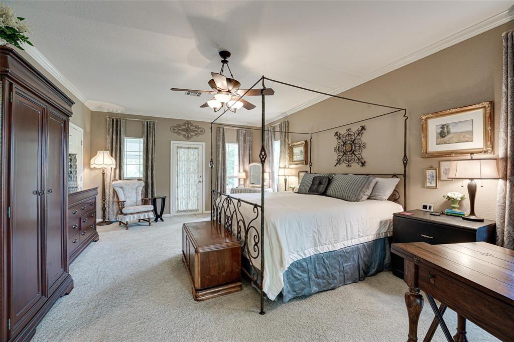 32018 Dove Trail Whitney, TX 76692 - Photo 13 of 36 a bed room with a bed and furniture