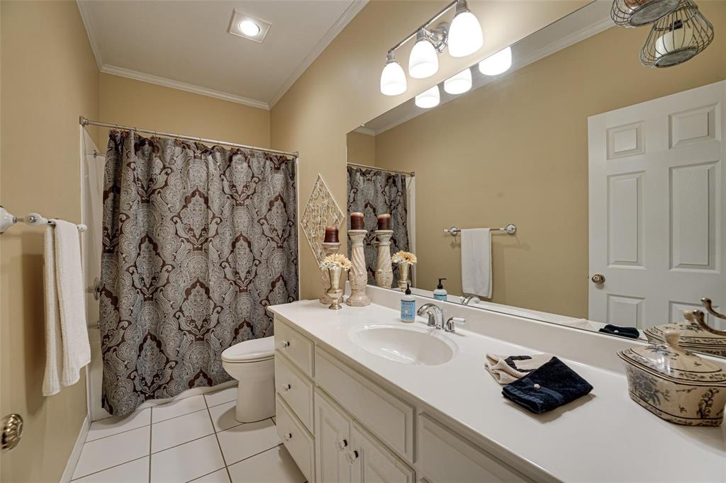 32018 Dove Trail Whitney, TX 76692 - Photo 20 of 36 a bathroom with a double vanity sink mirror and shower