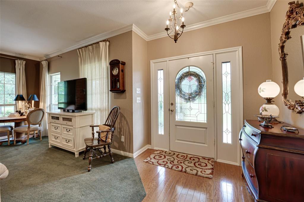 32018 Dove Trail Whitney, TX 76692 - Photo 2 of 36 a view of a livingroom with furniture and a flat screen tv