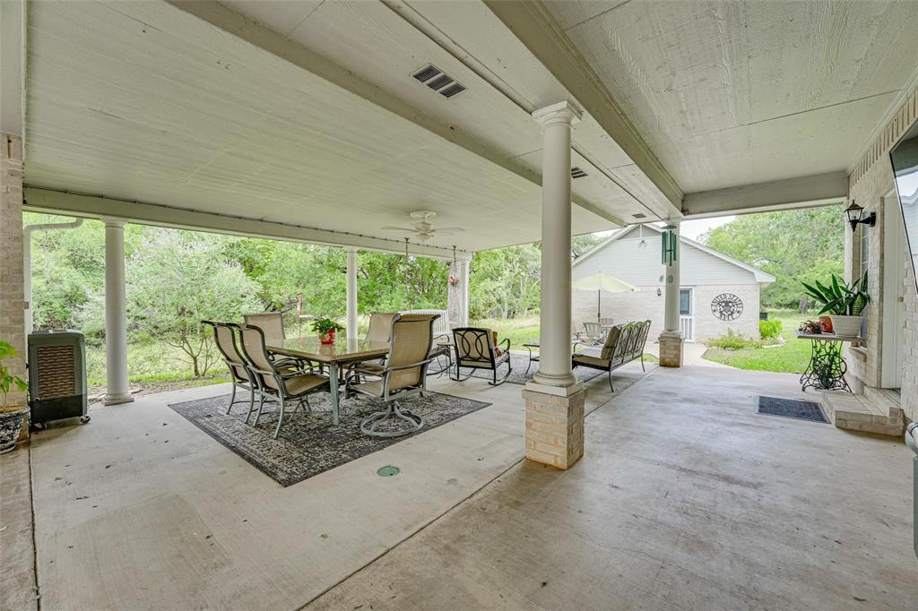 32018 Dove Trail Whitney, TX 76692 - Photo 22 of 36 a living room with patio furniture and garden view