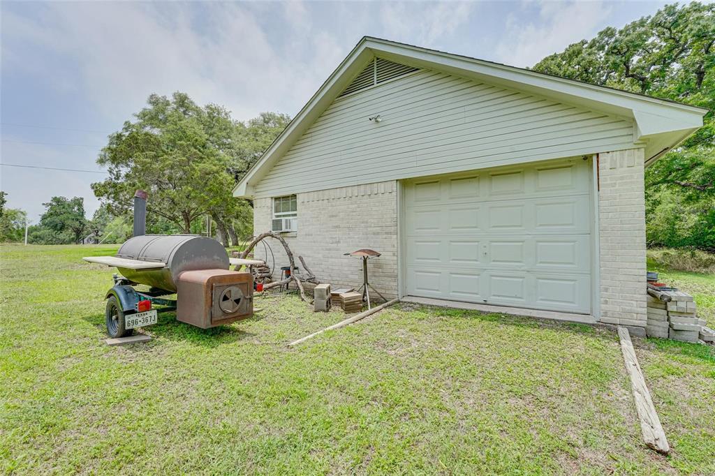32018 Dove Trail Whitney, TX 76692 - Photo 27 of 36 a view of a house with backyard space and garden