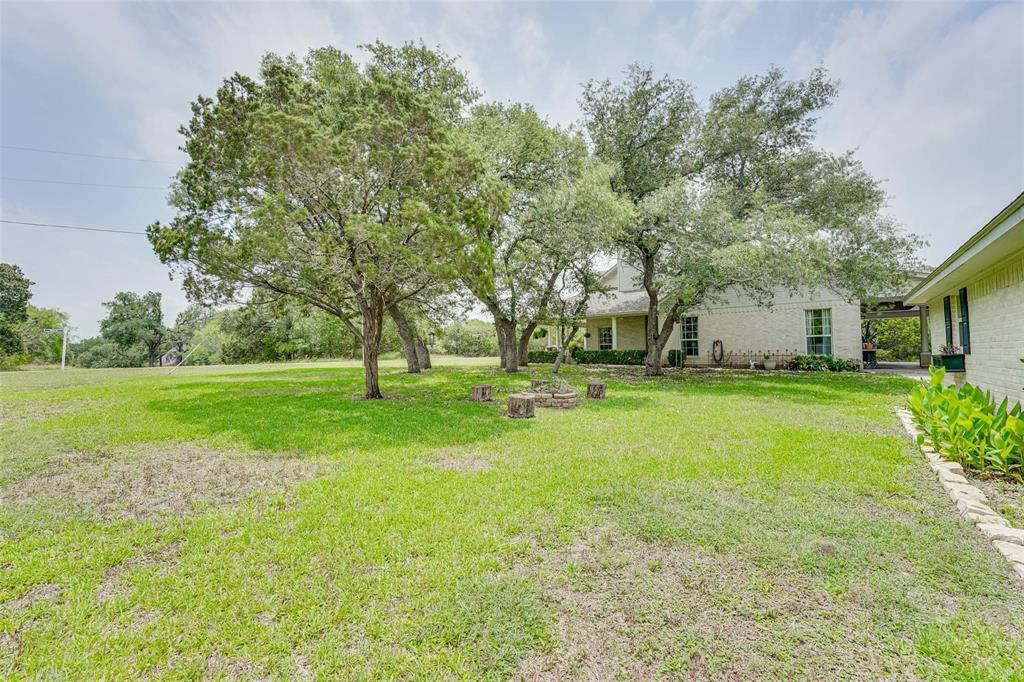 32018 Dove Trail Whitney, TX 76692 - Photo 29 of 36 a view of yard with tree s