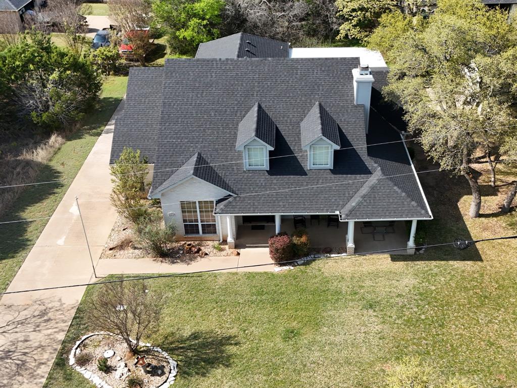 32018 Dove Trail Whitney, TX 76692 - Photo 32 of 36 a front view of a house with a yard