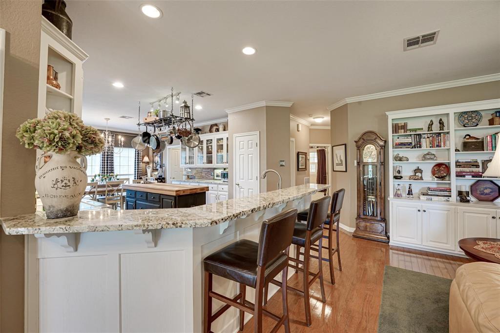 32018 Dove Trail Whitney, TX 76692 - Photo 5 of 36 a kitchen with stainless steel appliances kitchen island granite countertop a table and chairs