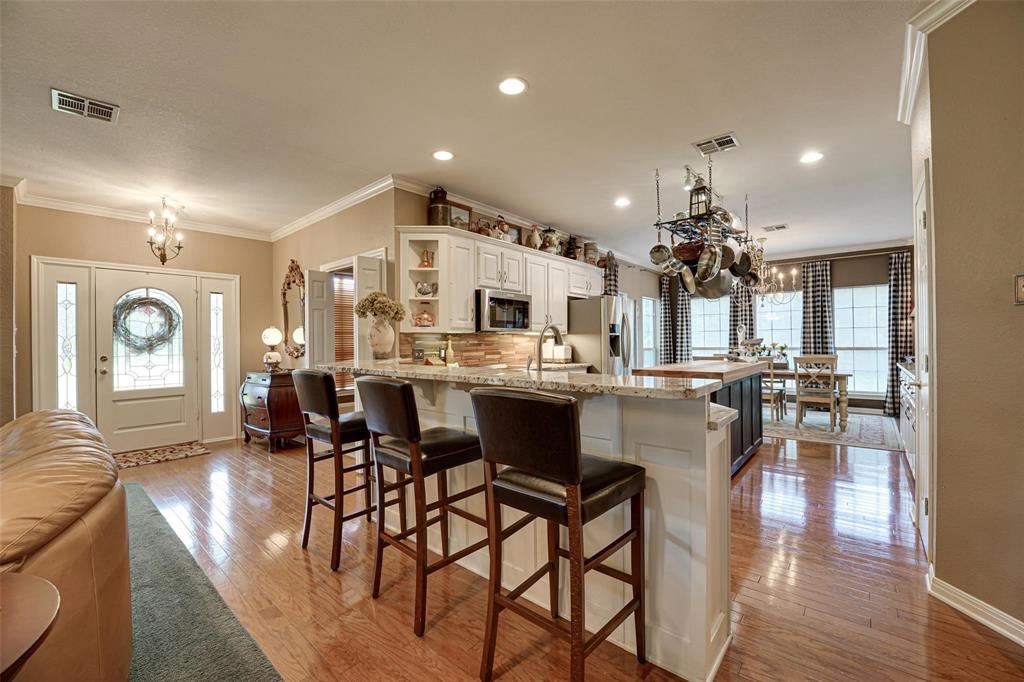 32018 Dove Trail Whitney, TX 76692 - Photo 6 of 36 a large kitchen with a table and chairs