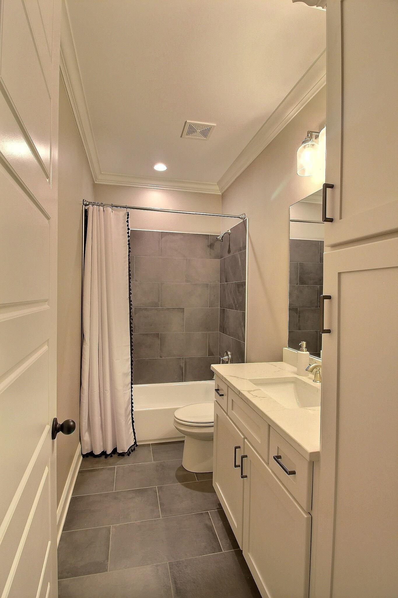 1254 Percheron Pass Collierville, TN 38017 - Photo 15 of 32 a bathroom with a double vanity sink toilet and shower