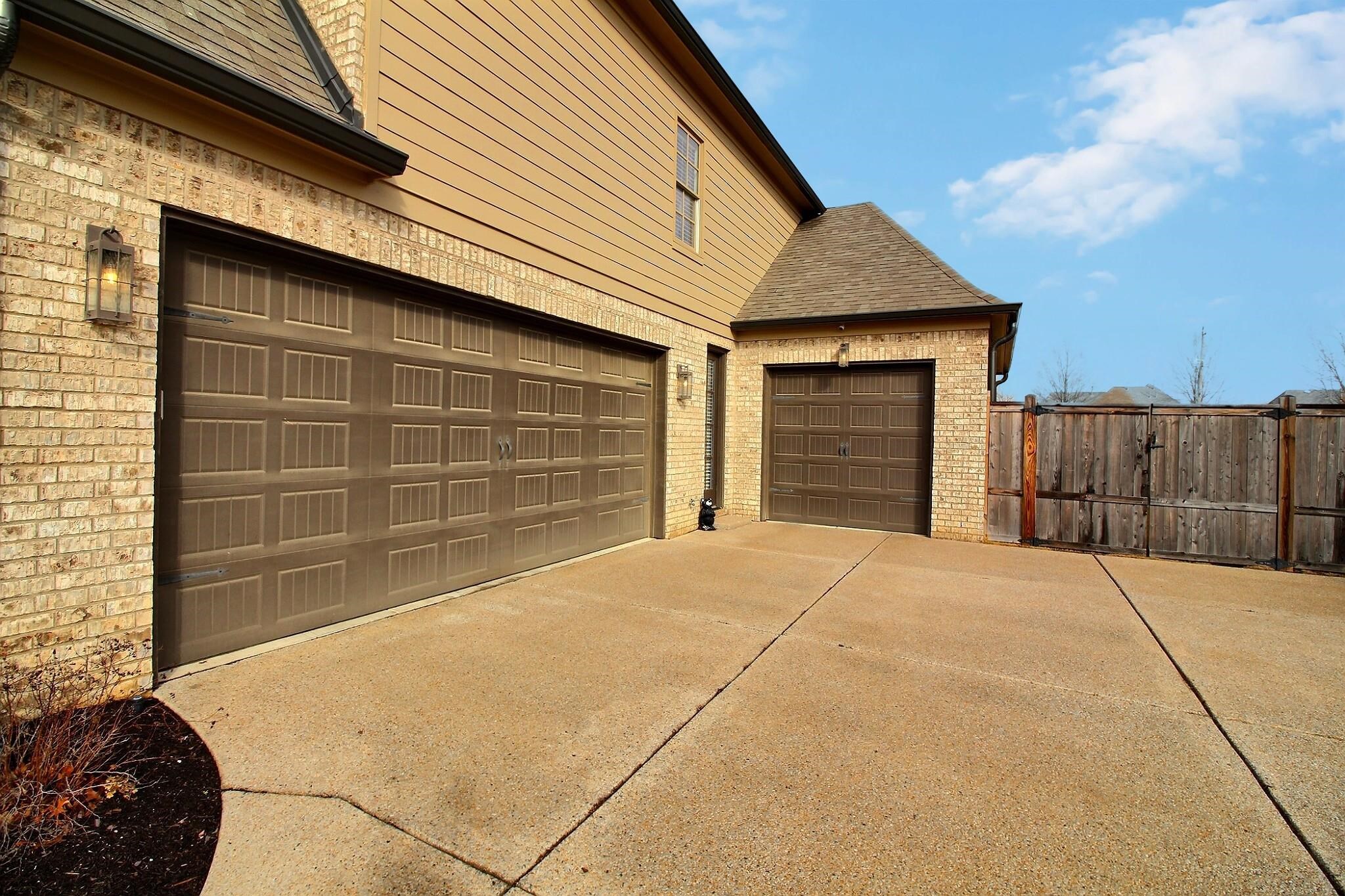 1254 Percheron Pass Collierville, TN 38017 - Photo 27 of 32 a front view of a house with garage
