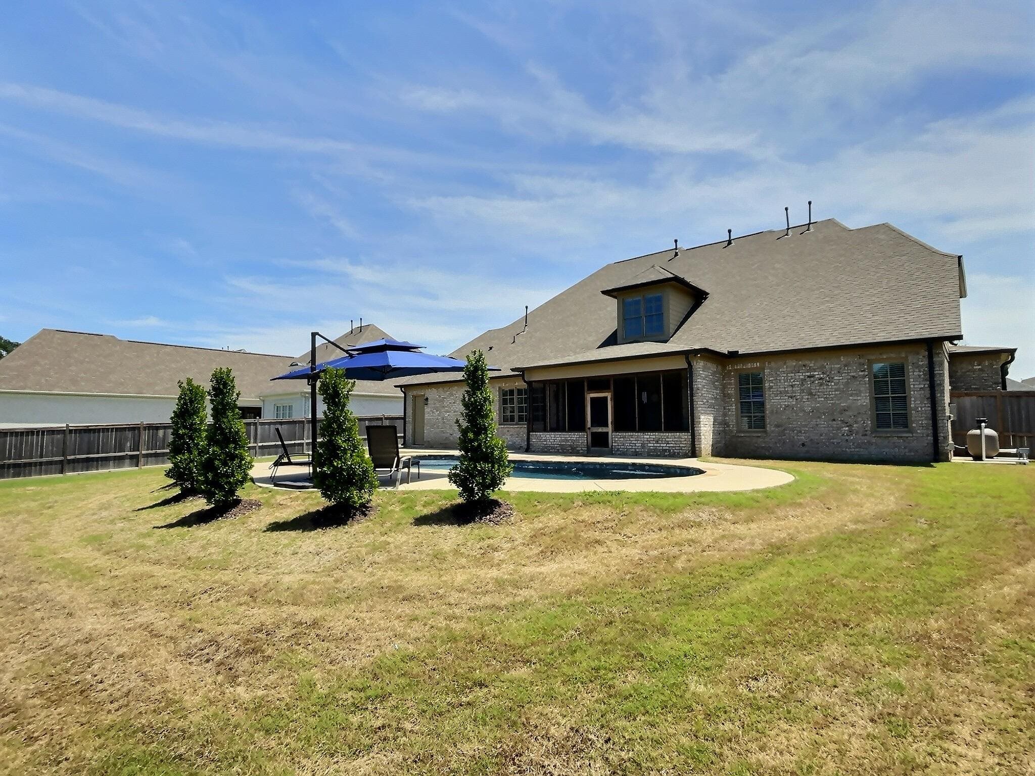 1254 Percheron Pass Collierville, TN 38017 - Photo 29 of 32 a view of a house with swimming pool and sitting area