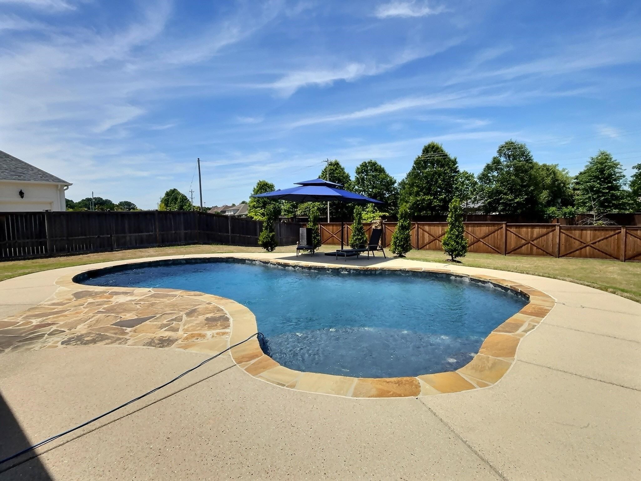 1254 Percheron Pass Collierville, TN 38017 - Photo 31 of 32 a view of a swimming pool with an outdoor seating