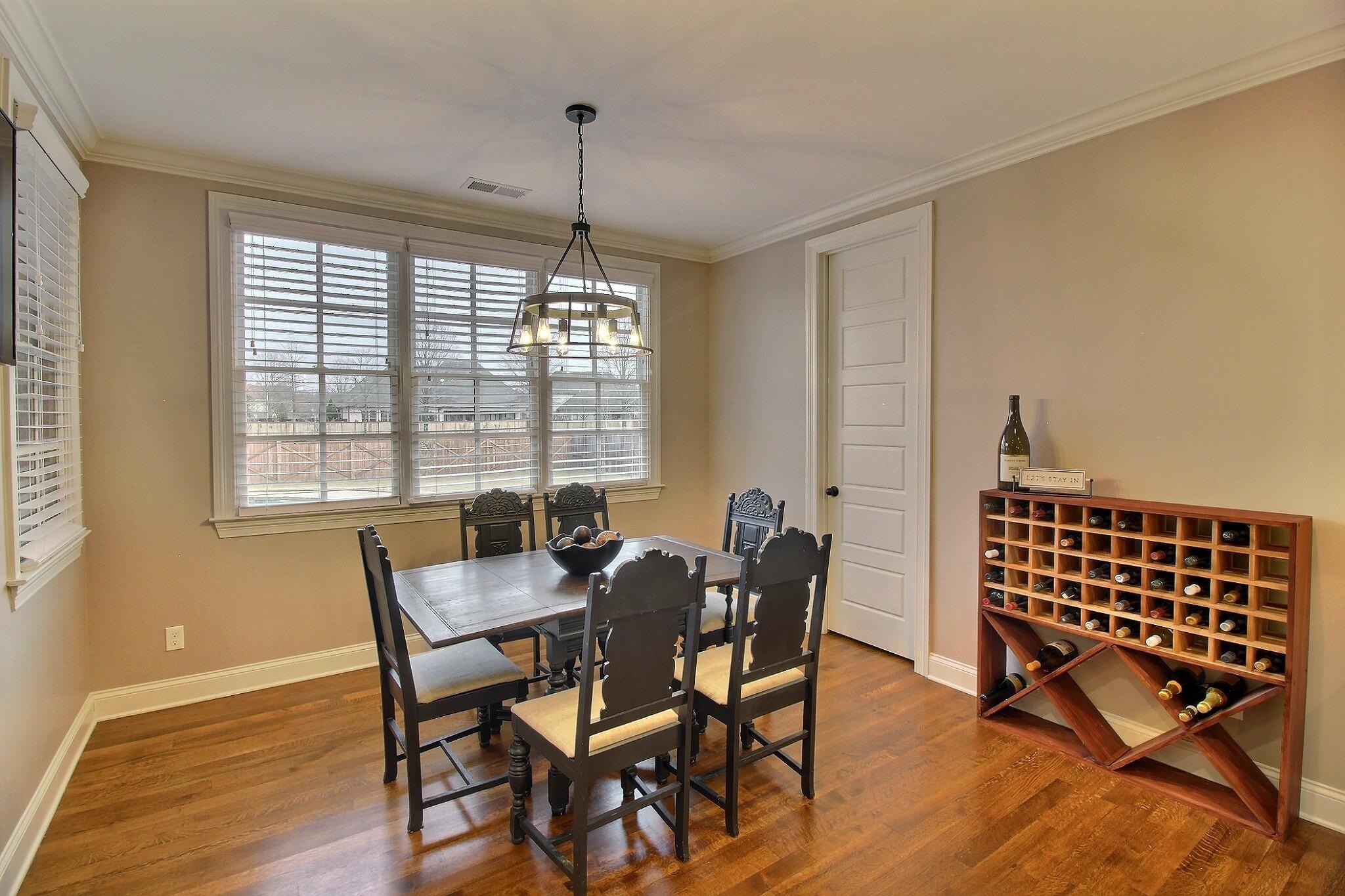 1254 Percheron Pass Collierville, TN 38017 - Photo 7 of 32 a view of a dining room with furniture window and wooden floor