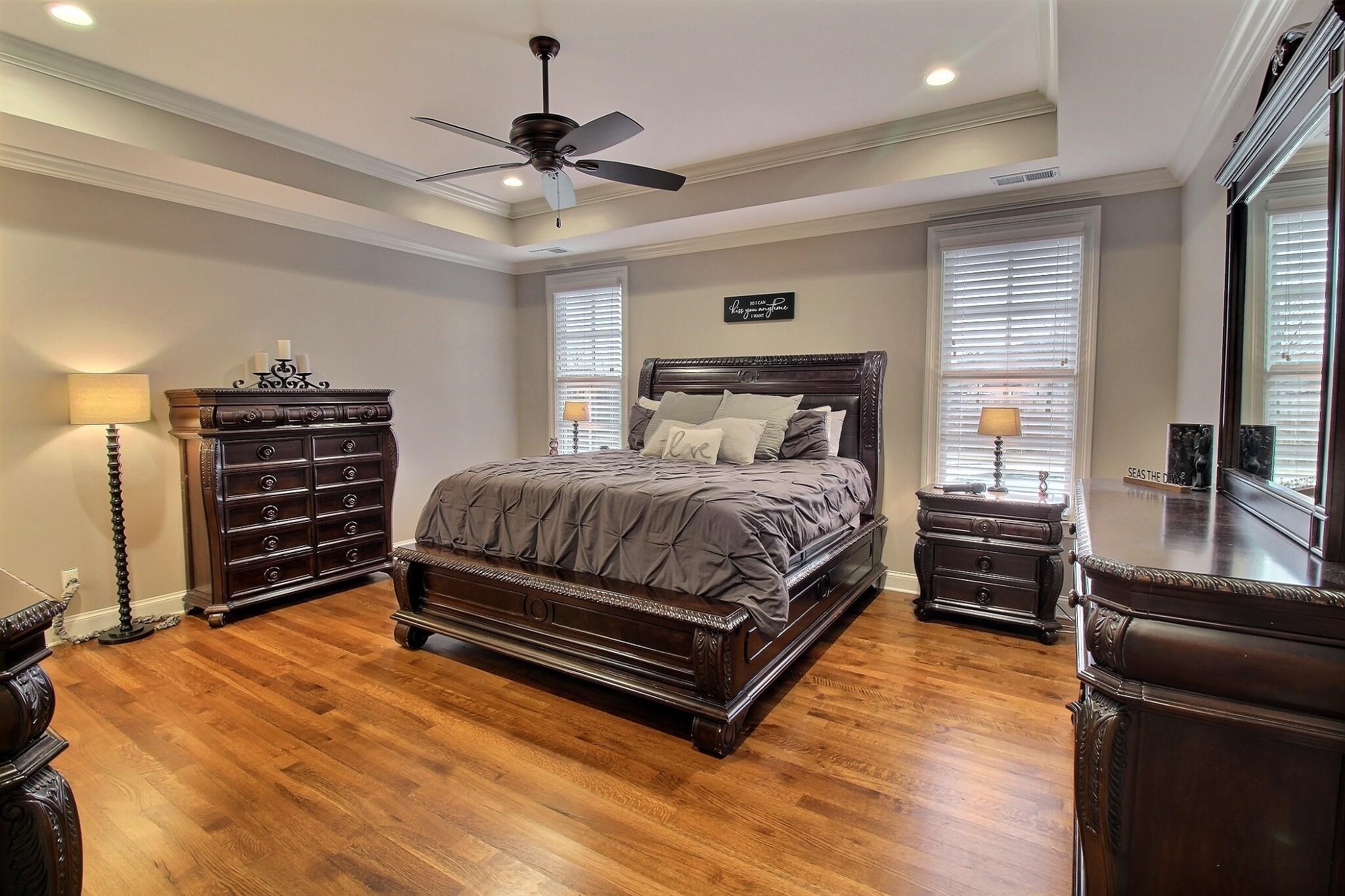 1254 Percheron Pass Collierville, TN 38017 - Photo 10 of 32 a bedroom with a bed and wooden floor