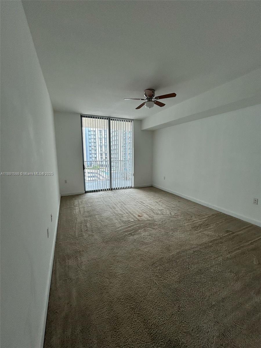 140 South Dixie Highway, Unit 816 Hollywood, FL 33020 - Photo 4 of 8 an empty room with windows and closet