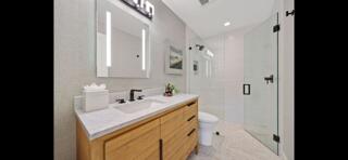 6110 North Ocean Boulevard, Unit 39 Ocean Ridge, FL 33435 - Photo 17 of 33 a bathroom with a sink and a mirror