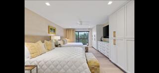 6110 North Ocean Boulevard, Unit 39 Ocean Ridge, FL 33435 - Photo 18 of 33 a large bedroom with bed