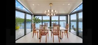 a kitchen with stainless steel appliances kitchen island granite countertop a refrigerator and a stove