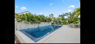 6110 North Ocean Boulevard, Unit 39 Ocean Ridge, FL 33435 - Photo 31 of 33 a view of a swimming pool with an outdoor space