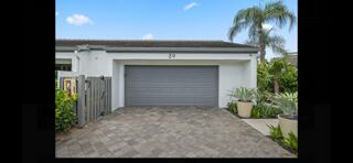 6110 North Ocean Boulevard, Unit 39 Ocean Ridge, FL 33435 - Photo 33 of 33 view of backyard with potted plants