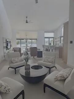 a bedroom with a bed and painting on the wall