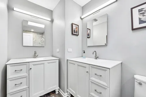 a view with two sink and a mirror