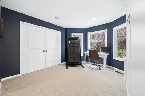 a view of a livingroom with a balcony and furniture