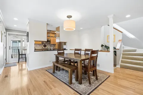 a view of a dining room with furniture and wooden floor