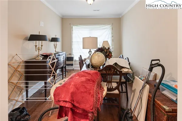 a bedroom with furniture and a window