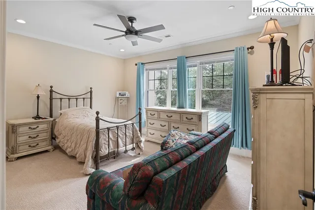 a bedroom with furniture and a window