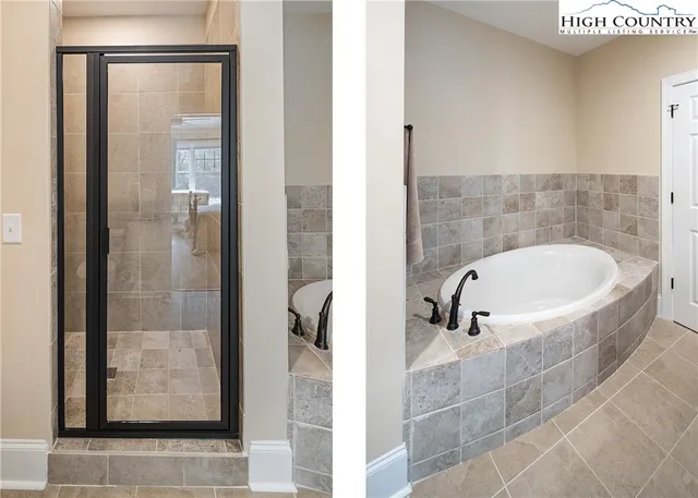 a bathroom with a bathtub and shower