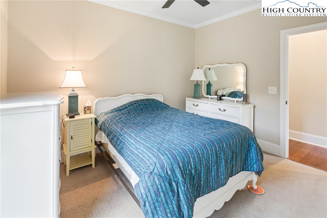 155 Gateway Drive, Unit 201 Boone, NC 28607 - Photo 18 of 23 a bedroom with a bed and a lamp