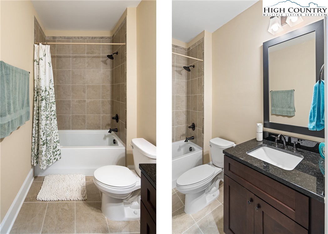155 Gateway Drive, Unit 201 Boone, NC 28607 - Photo 20 of 23 a bathroom with a sink a toilet a mirror a bathtub and shower