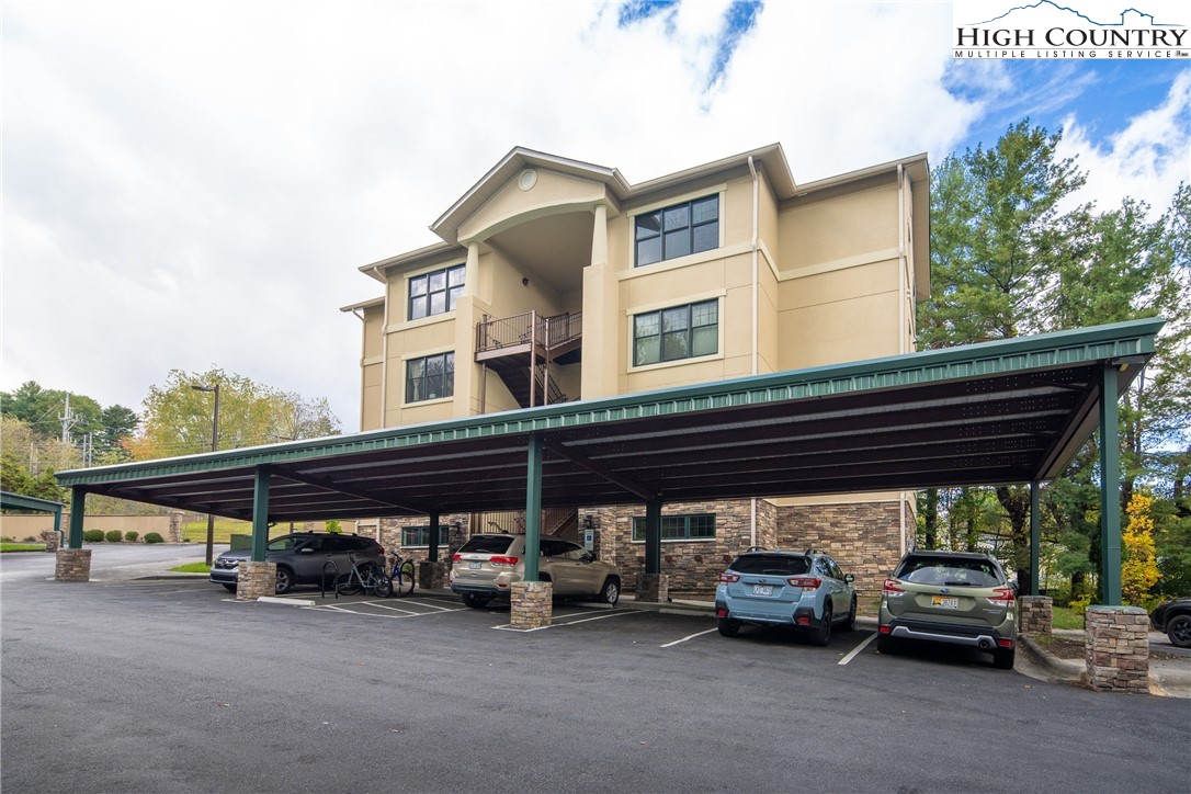 155 Gateway Drive, Unit 201 Boone, NC 28607 - Photo 2 of 23 a view of a car park in front of house