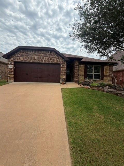 202 Tower Circle Terrell, TX 75160 - Photo 8 of 39 a front view of a house with a garden and trees