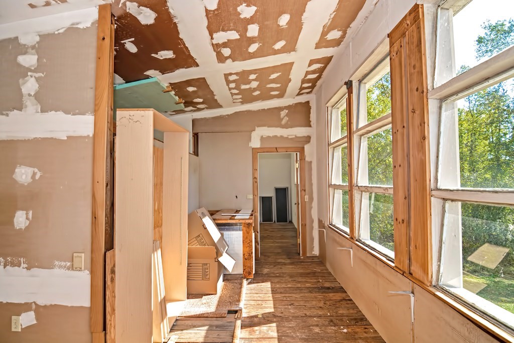 1167 Lower Road Hardwick, MA 01031 - Photo 22 of 42 a view of a hallway with wooden floor and furniture