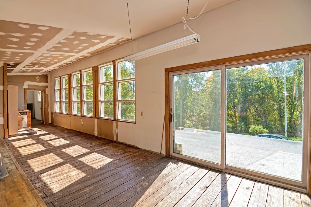 1167 Lower Road Hardwick, MA 01031 - Photo 26 of 42 a view of an empty room with wooden floor and a window