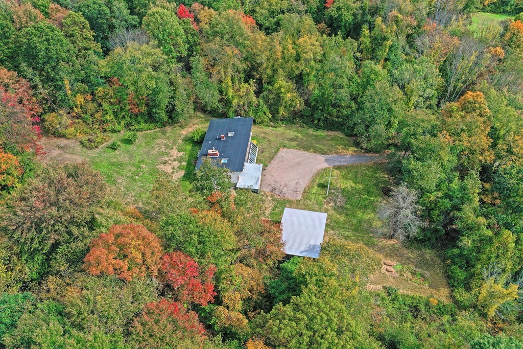 1167 Lower Road Hardwick, MA 01031 - Photo 10 of 42 an aerial view of a house with outdoor space and trees all around