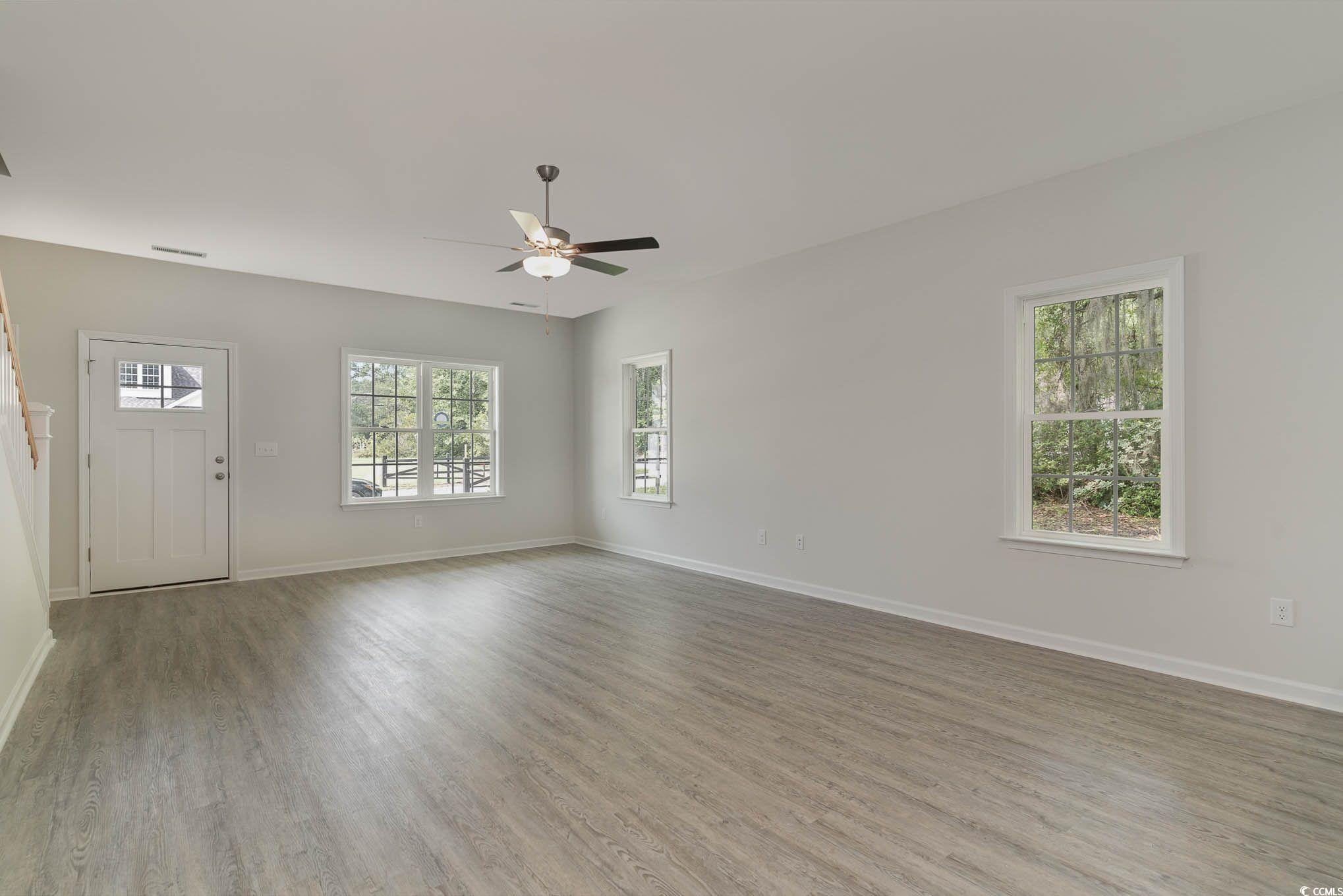 303 Lakota Loop Longs, SC 29568 - Photo 3 of 17 Unfurnished living room featuring light hardwood /