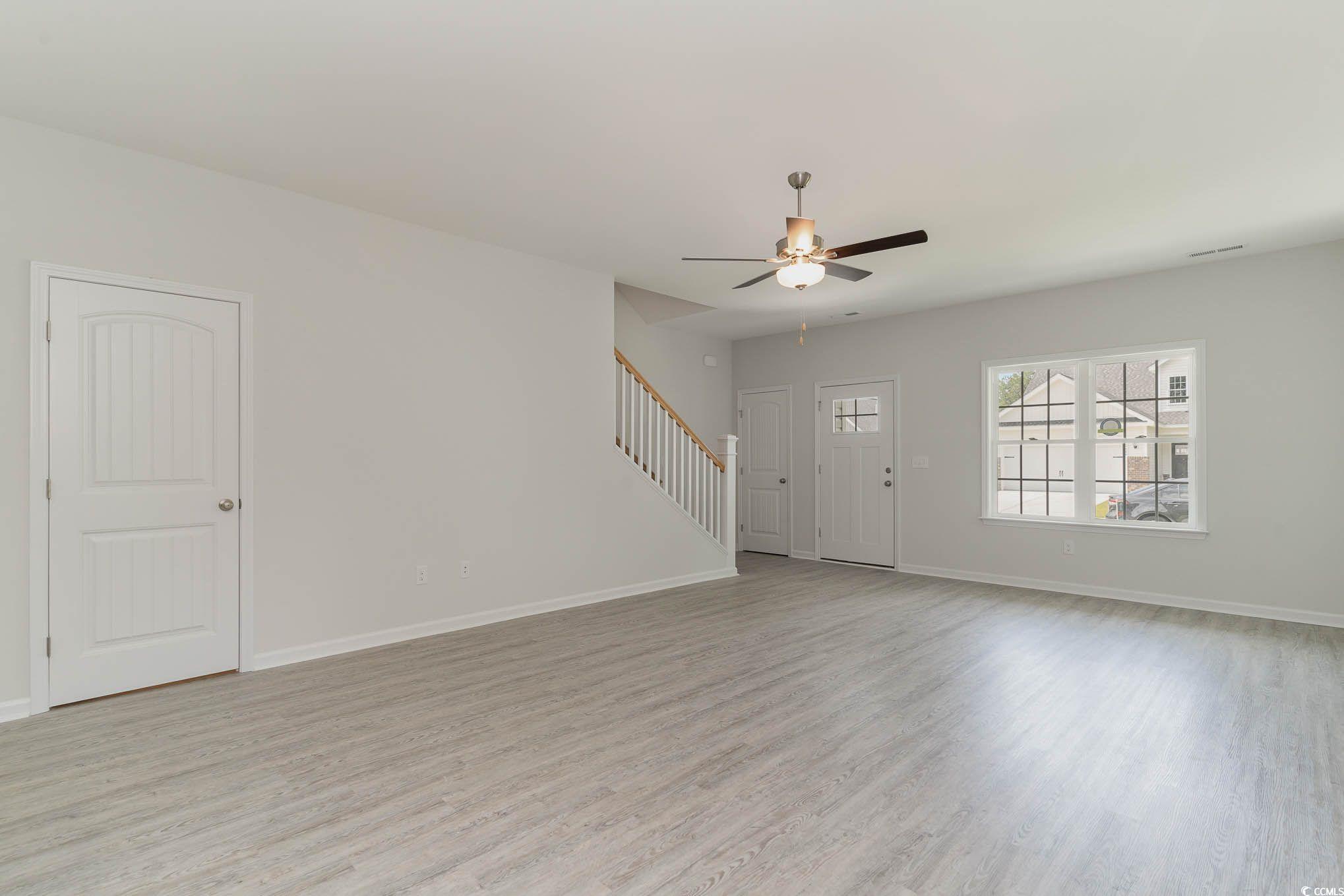 303 Lakota Loop Longs, SC 29568 - Photo 4 of 17 Spare room with light wood-type flooring and ceili