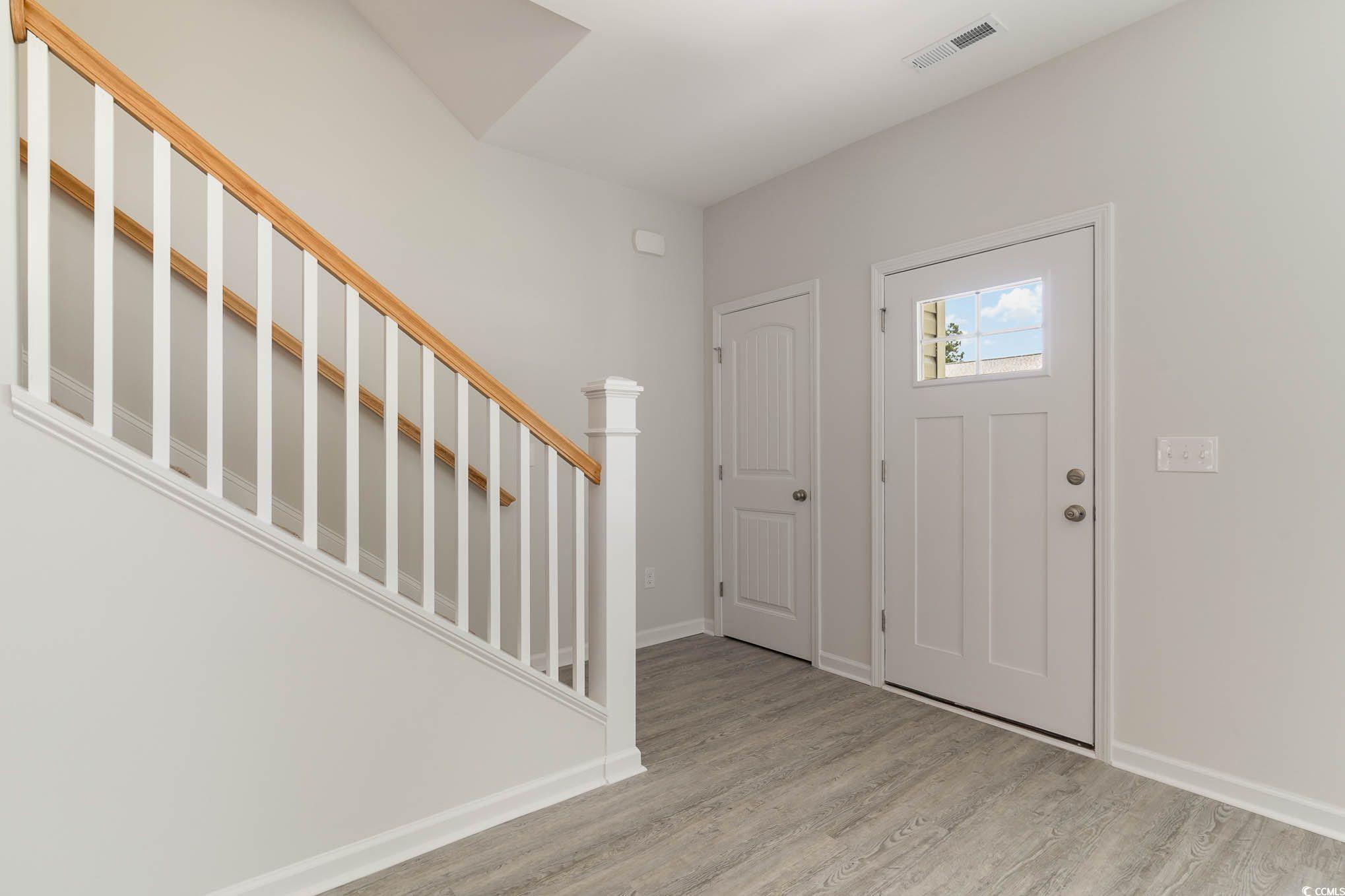 303 Lakota Loop Longs, SC 29568 - Photo 10 of 17 Foyer entrance featuring wood-type flooring