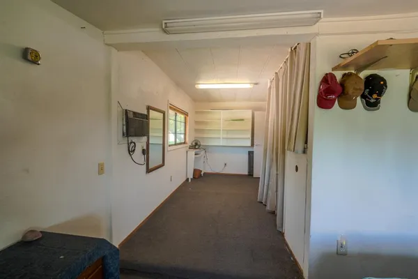 a view of hallway with stairs and a couch