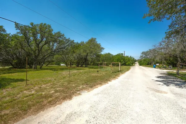 a view of a yard with a fountain