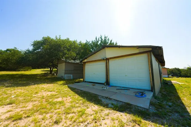 a view of a back yard of the house