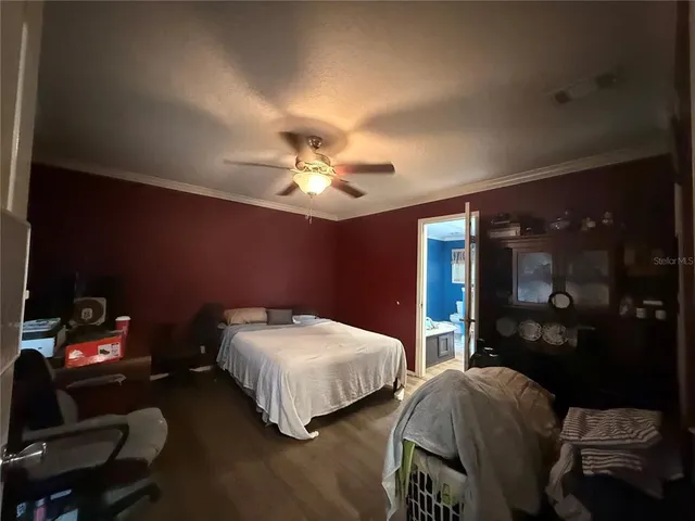 a bedroom with two beds and a chandelier