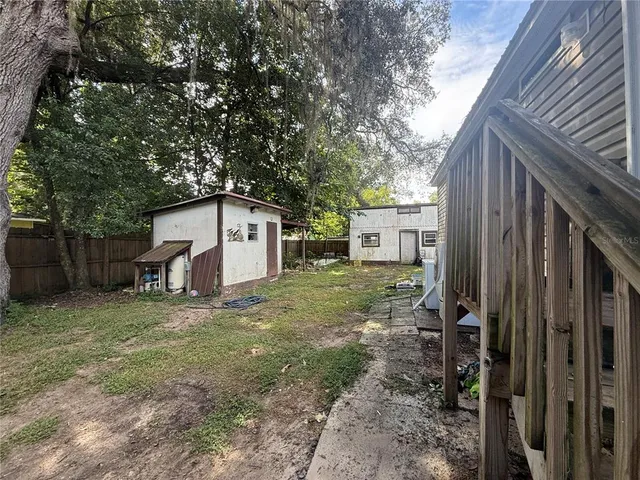 a house view with a backyard space