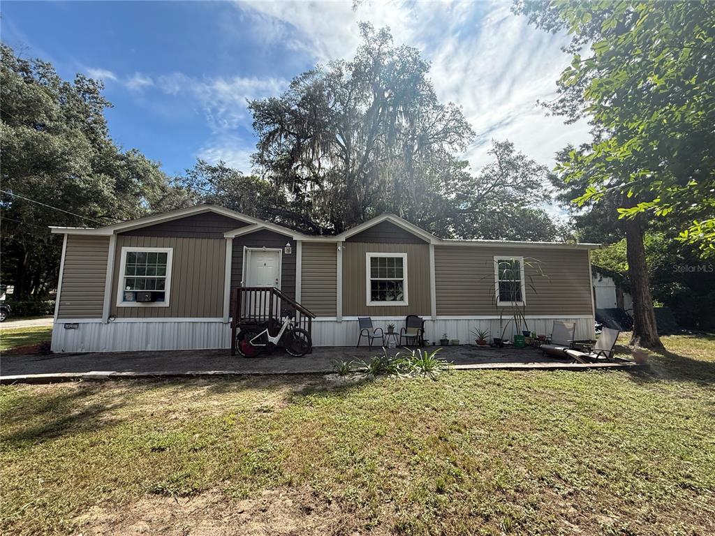 29040 Sentinel Street Nobleton, FL 34661 - Photo 2 of 21 a view of a house with a yard
