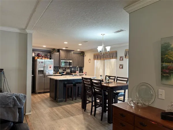 a view of a dining room with furniture