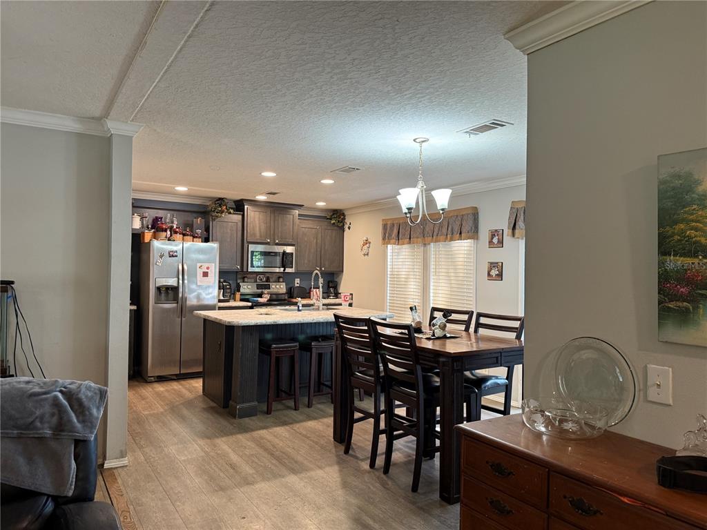 29040 Sentinel Street Nobleton, FL 34661 - Photo 7 of 21 a view of a dining room with furniture