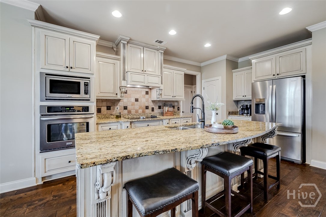 7 Reed Grass Lane Savannah, GA 31405 - Photo 15 of 70 Cooktop, microwave, separate oven, hood vent, and under sink 2.5 gallon hot water heater
