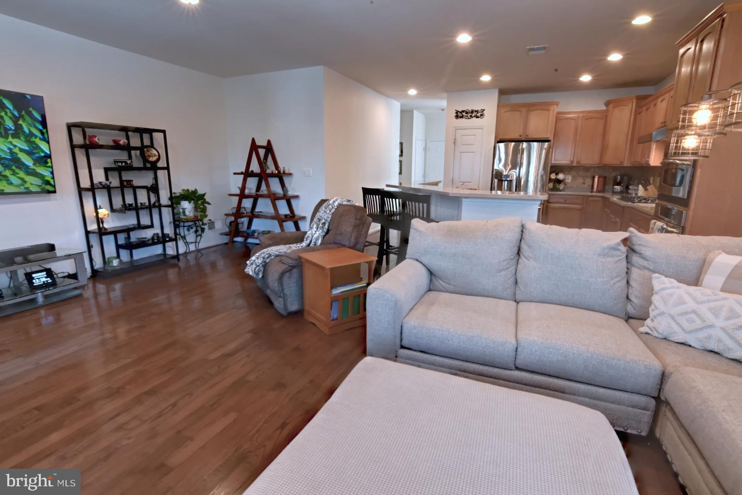 13170 Triple Crown Loop Gainesville, VA 20155 - Photo 27 of 71 a living room with furniture and a wooden floor