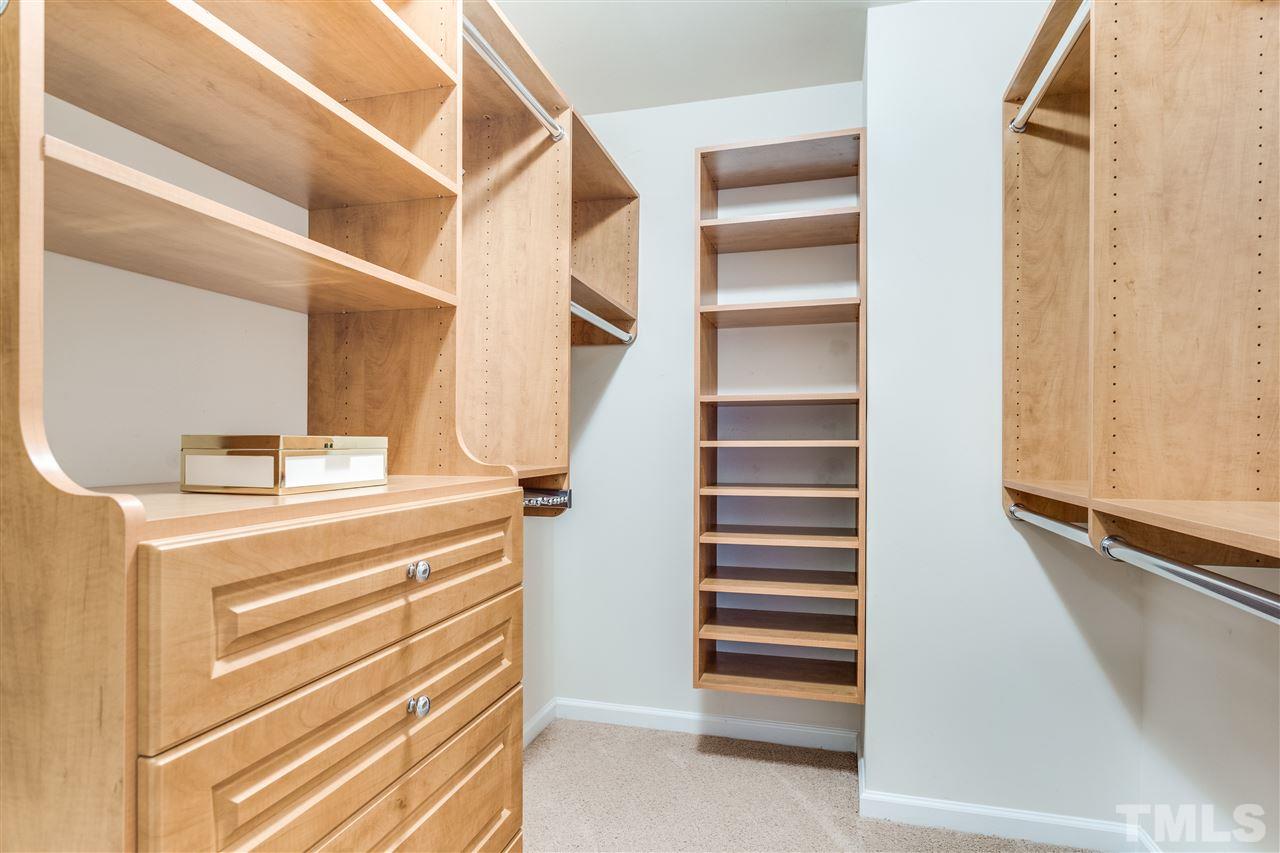 8702 Braxwood Place Raleigh, NC 27617 - Photo 18 of 24 a view of walk in closet with empty racks