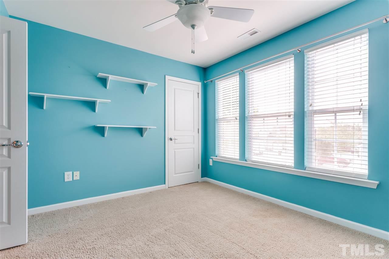 8702 Braxwood Place Raleigh, NC 27617 - Photo 20 of 24 a view of an empty room with a window